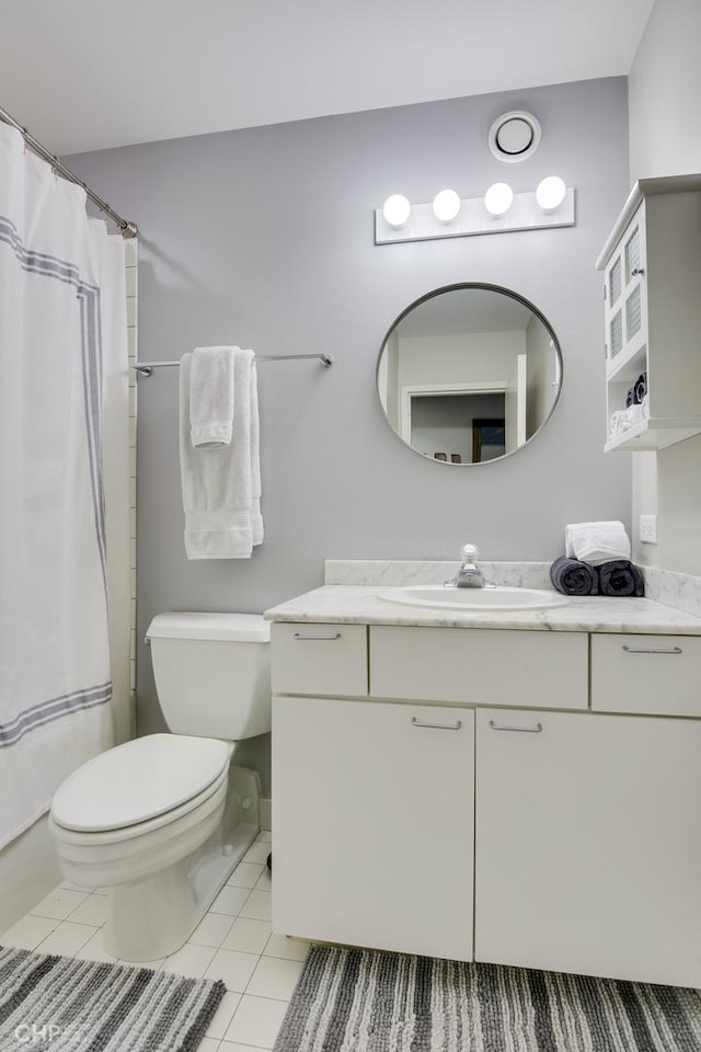 20 N State St Unit 909, Chicago, IL 60602 - full bathroom with vanity, tile patterned floors, and a shower with shower curtain