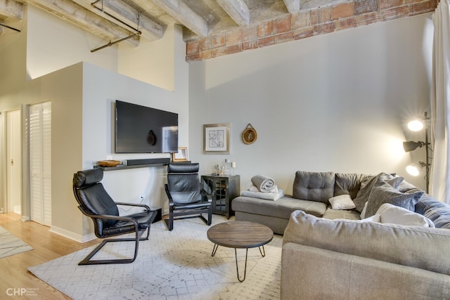 20 N State St Unit 909, Chicago, IL 60602 - living room with a high ceiling, wood finished floors, and beam ceiling