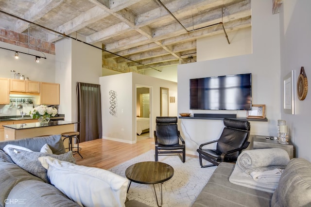 20 N State St Unit 909, Chicago, IL 60602 - living room with a towering ceiling and light wood-style flooring