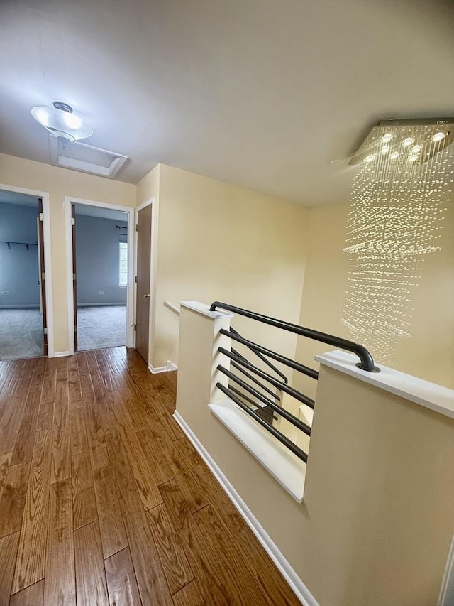26296 N Green St Unit 5C, Mundelein, IL 60060 - hall with an upstairs landing, wood finished floors, and attic access