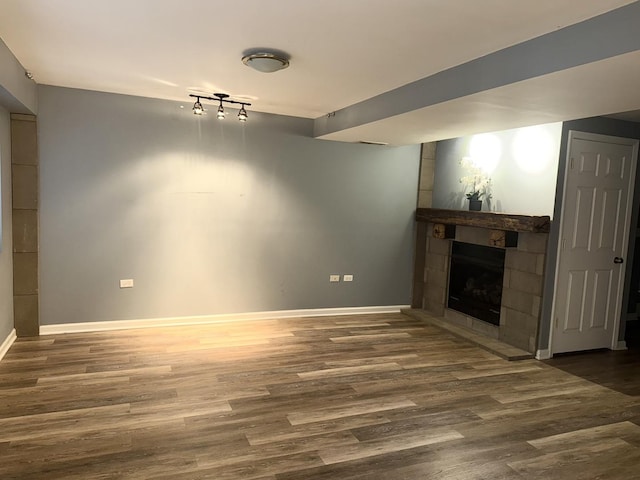 26296 N Green St Unit 5C, Mundelein, IL 60060 - unfurnished living room featuring wood finished floors and a tile fireplace