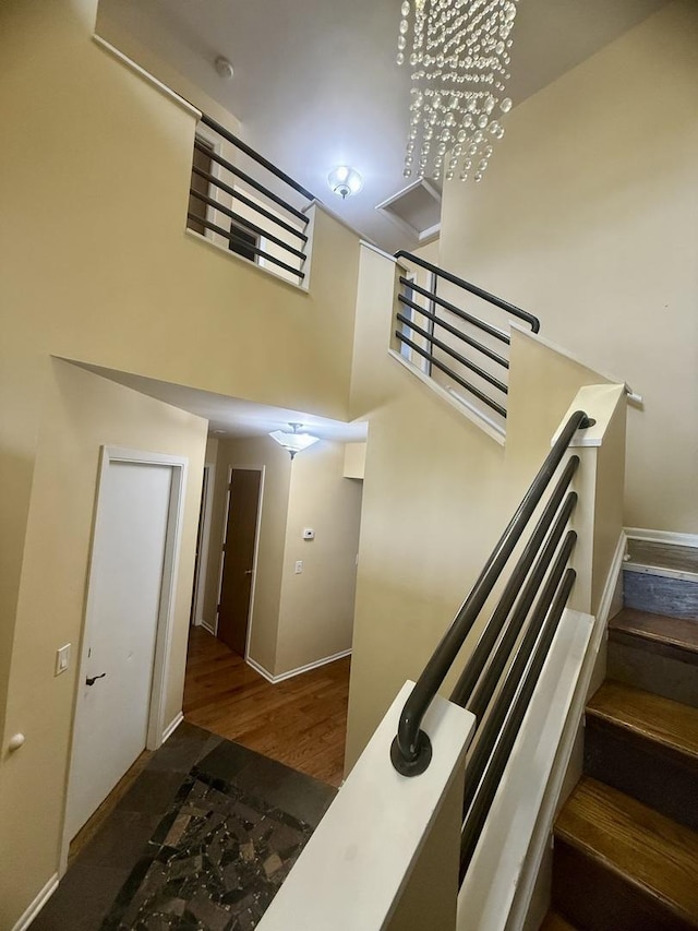 26296 N Green St Unit 5C, Mundelein, IL 60060 - staircase with a high ceiling and wood finished floors