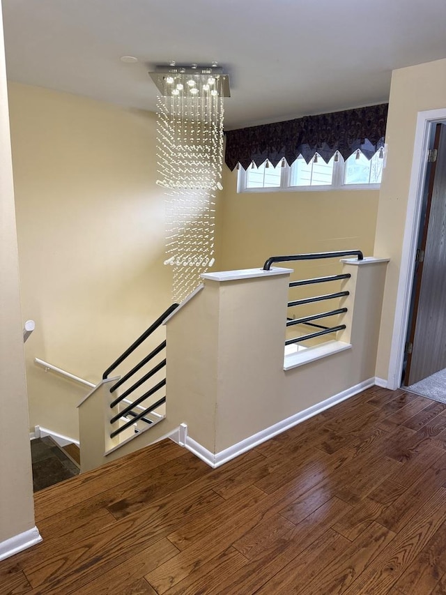 26296 N Green St Unit 5C, Mundelein, IL 60060 - stairs featuring wood finished floors and a chandelier