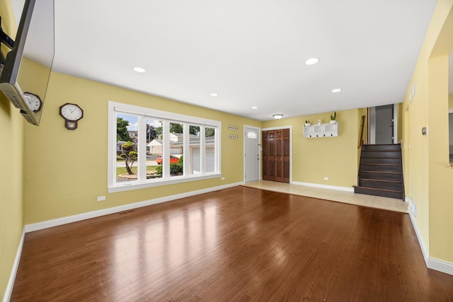 9070 Shady Ln, Hickory Hills, IL 60457 - unfurnished living room with wood finished floors, stairs, and recessed lighting