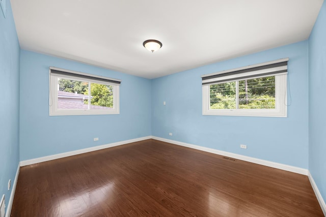 9070 Shady Ln, Hickory Hills, IL 60457 - empty room with dark wood-style floors and baseboards