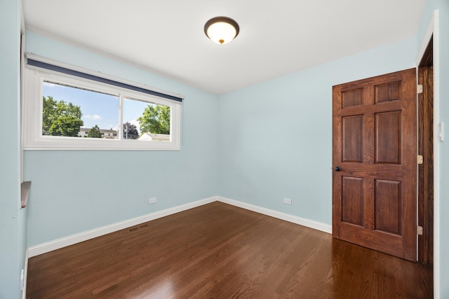 9070 Shady Ln, Hickory Hills, IL 60457 - empty room with dark wood-style floors and baseboards
