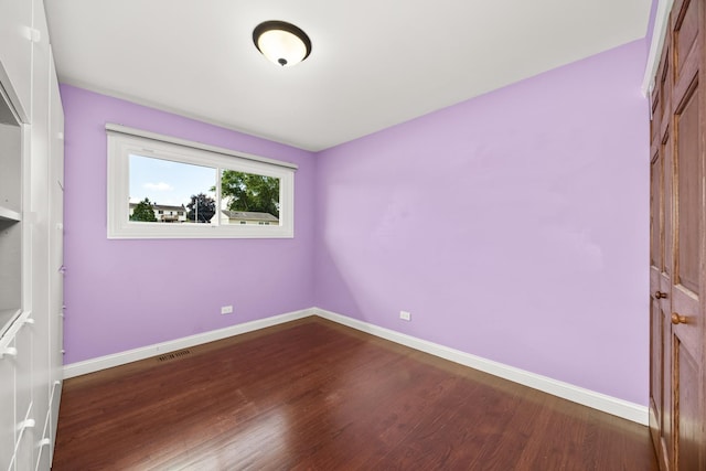 9070 Shady Ln, Hickory Hills, IL 60457 - empty room featuring dark wood finished floors and baseboards