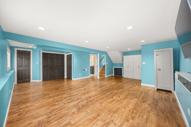 9070 Shady Ln, Hickory Hills, IL 60457 - unfurnished living room with stairway, light wood-style flooring, and recessed lighting