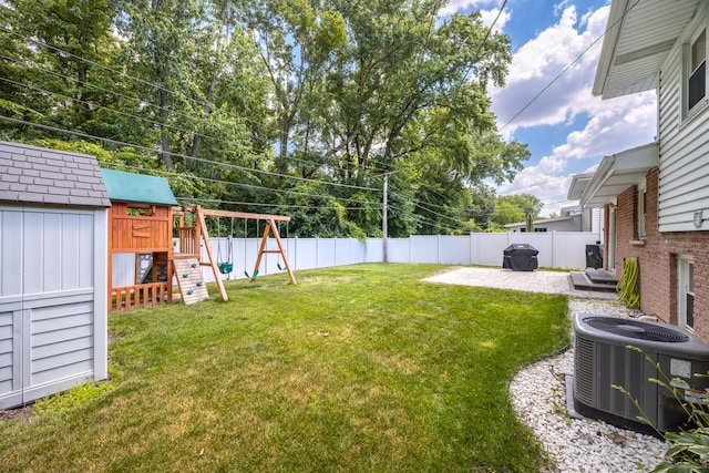 9070 Shady Ln, Hickory Hills, IL 60457 - fenced backyard featuring a playground, a patio, and a storage shed