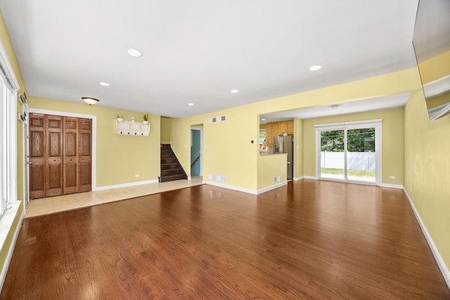 9070 Shady Ln, Hickory Hills, IL 60457 - unfurnished living room with stairway, wood finished floors, and recessed lighting