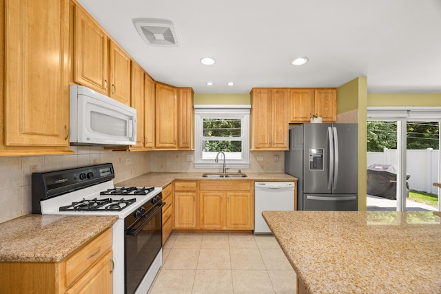 9070 Shady Ln, Hickory Hills, IL 60457 - kitchen featuring white appliances, decorative backsplash, light tile patterned floors, light stone counters, and recessed lighting