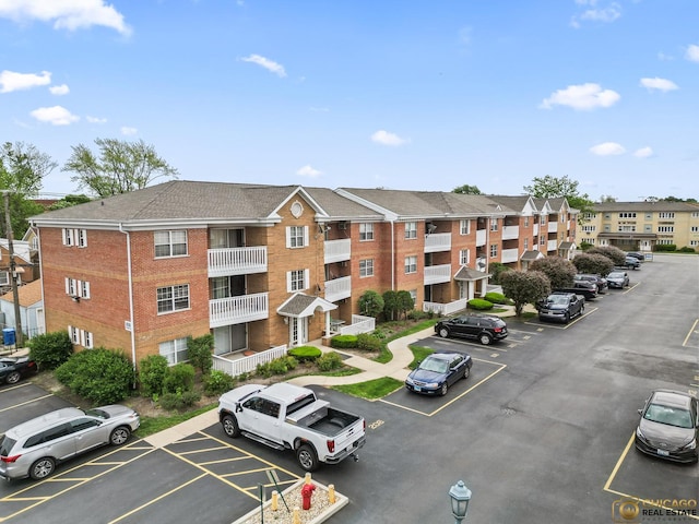 6561 W School Ave Unit 305C, Chicago, IL 60634 - view of apartment building / complex with uncovered parking