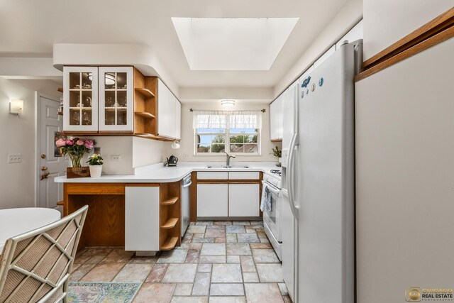 6561 W School Ave Unit 305C, Chicago, IL 60634 - kitchen with white appliances, open shelves, light stone finish flooring, light countertops, and white cabinets