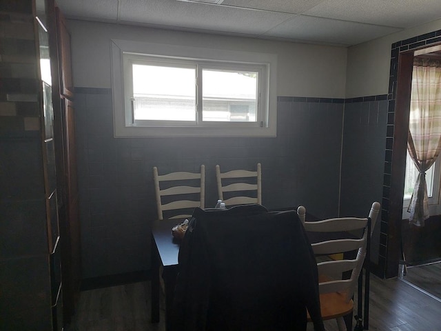 4421 W 87th St, Hometown, IL 60456 - dining space featuring tile walls, wood finished floors, and a wainscoted wall