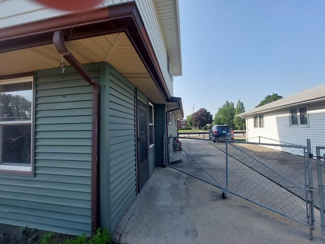 4421 W 87th St, Hometown, IL 60456 - view of home's exterior with a gate