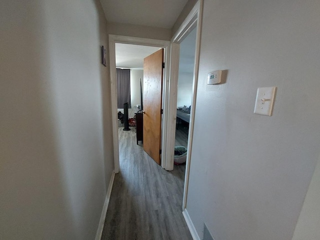 4421 W 87th St, Hometown, IL 60456 - hallway featuring wood finished floors and baseboards