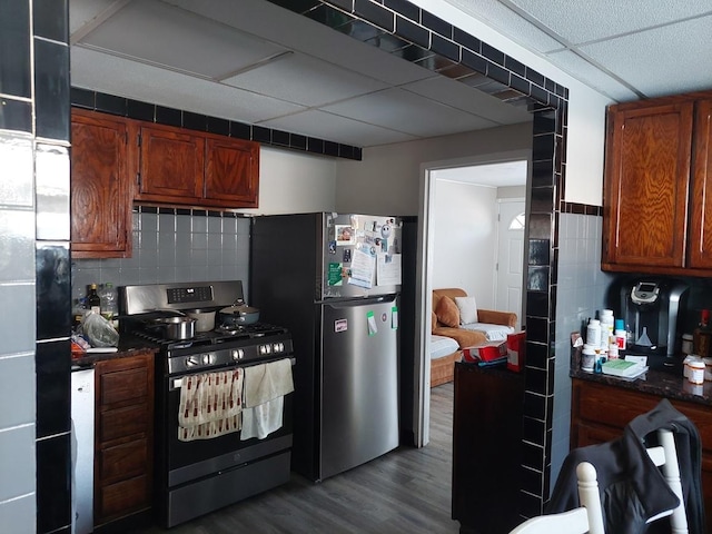 4421 W 87th St, Hometown, IL 60456 - kitchen featuring range with gas stovetop, freestanding refrigerator, dark countertops, and dark wood finished floors