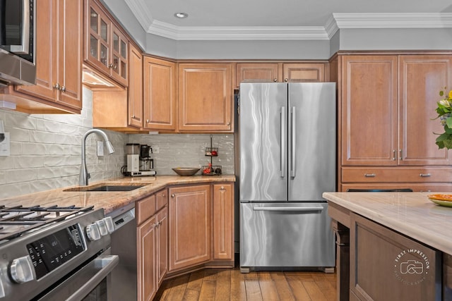 482 River Front Cir, Naperville, IL 60540 - kitchen with appliances with stainless steel finishes, light wood-style floors, light stone countertops, ornamental molding, and glass insert cabinets