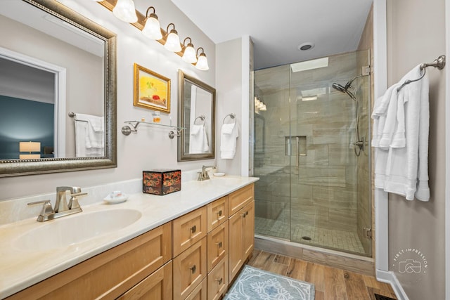 482 River Front Cir, Naperville, IL 60540 - bathroom featuring double vanity, a stall shower, and wood finished floors