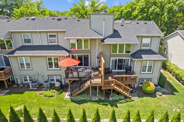 482 River Front Cir, Naperville, IL 60540 - back of property with stairway, a chimney, a wooden deck, and a lawn