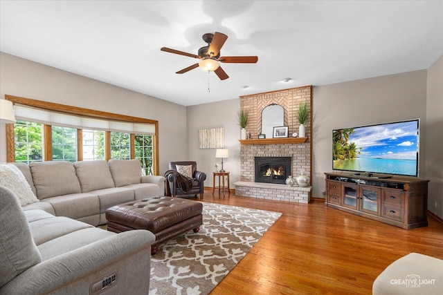 10660 Great Egret Dr, Orland Park, IL 60467 - living room with a ceiling fan, wood finished floors, and a brick fireplace