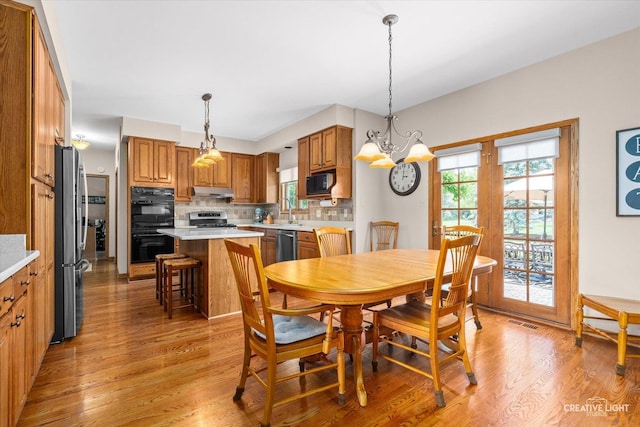 10660 Great Egret Dr, Orland Park, IL 60467 - dining room featuring plenty of natural light and light wood finished floors