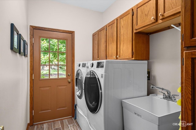 10660 Great Egret Dr, Orland Park, IL 60467 - laundry room with cabinet space, washer and dryer, and wood finished floors