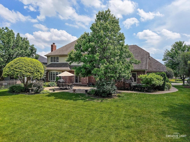10660 Great Egret Dr, Orland Park, IL 60467 - rear view of property with a patio area, a chimney, and brick siding
