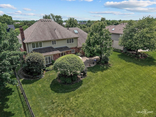 10660 Great Egret Dr, Orland Park, IL 60467 - rear view of property with a chimney, a lawn, and roof with shingles