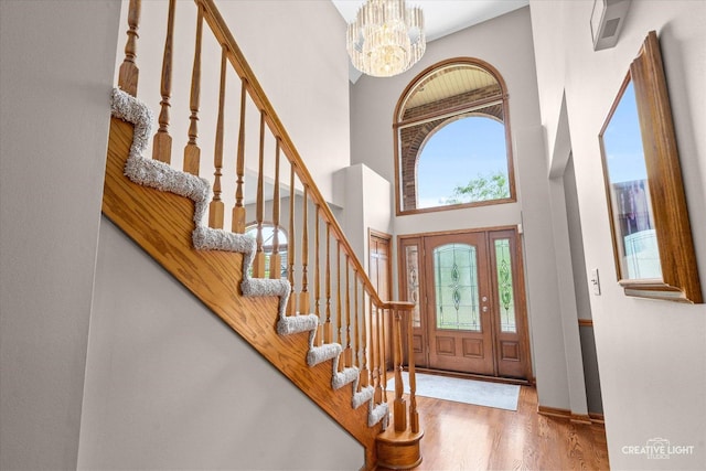 10660 Great Egret Dr, Orland Park, IL 60467 - foyer with a chandelier, a high ceiling, wood finished floors, and stairway