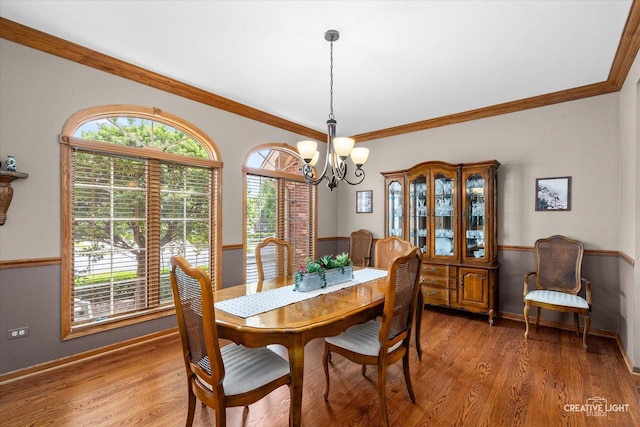 10660 Great Egret Dr, Orland Park, IL 60467 - dining space with a chandelier, light wood-type flooring, plenty of natural light, and ornamental molding