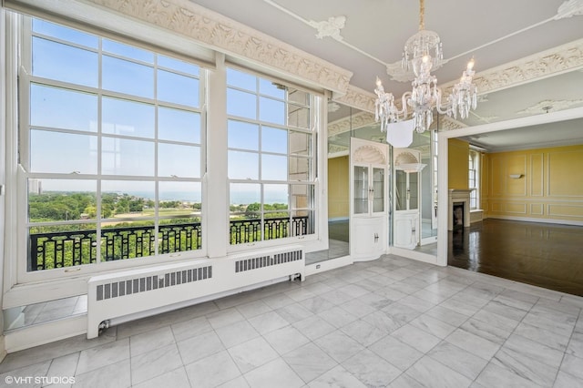 1550 N State Pkwy Unit 801, Chicago, IL 60610 - unfurnished sunroom with radiator heating unit, a chandelier, and plenty of natural light