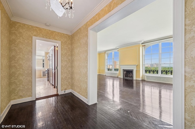 1550 N State Pkwy Unit 801, Chicago, IL 60610 - unfurnished living room featuring a chandelier, dark wood finished floors, wallpapered walls, ornamental molding, and a fireplace