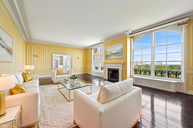 1550 N State Pkwy Unit 801, Chicago, IL 60610 - living room featuring a decorative wall, dark wood-style flooring, crown molding, a fireplace, and radiator heating unit