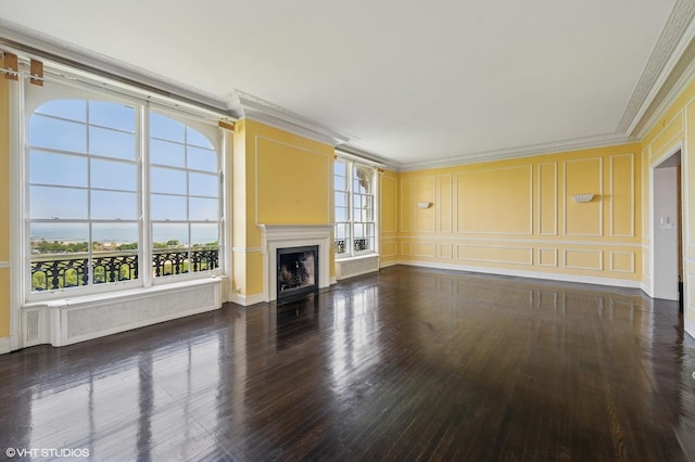 1550 N State Pkwy Unit 801, Chicago, IL 60610 - unfurnished living room with a decorative wall, ornamental molding, wood finished floors, a fireplace with flush hearth, and radiator heating unit