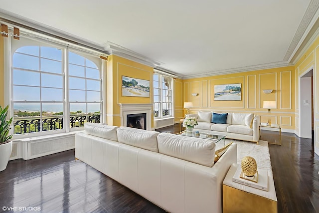 1550 N State Pkwy Unit 801, Chicago, IL 60610 - living room featuring crown molding, dark wood-style floors, a decorative wall, and a fireplace