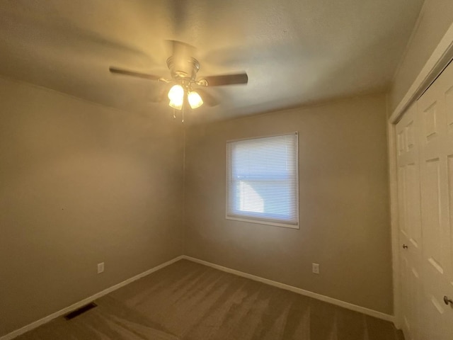 522 N 3rd Ave, Chenoa, IL 61726 - unfurnished bedroom with a closet, carpet flooring, and ceiling fan