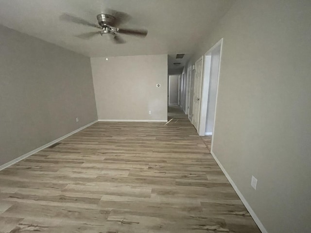 522 N 3rd Ave, Chenoa, IL 61726 - unfurnished room featuring a ceiling fan and wood finished floors