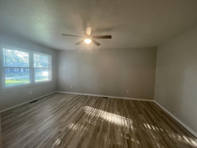 522 N 3rd Ave, Chenoa, IL 61726 - empty room with wood finished floors and ceiling fan