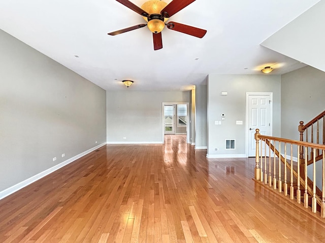 15 Busse Hwy, Park Ridge, IL 60068 - unfurnished living room with ceiling fan, light wood finished floors, and stairs