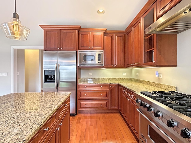 15 Busse Hwy, Park Ridge, IL 60068 - kitchen featuring under cabinet range hood, stainless steel appliances, light stone counters, glass insert cabinets, and light wood-style flooring