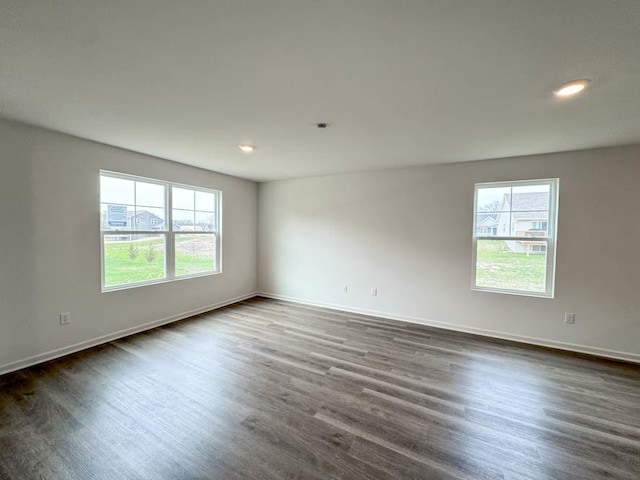 1100 58th Rd Unit 0020, Union Grove, WI 53182 - spare room featuring healthy amount of natural light, dark wood-style flooring, and recessed lighting