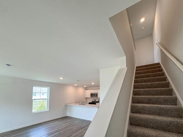 1100 58th Rd Unit 0020, Union Grove, WI 53182 - staircase featuring wood finished floors and recessed lighting