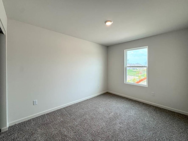 1100 58th Rd Unit 0020, Union Grove, WI 53182 - spare room with carpet and baseboards