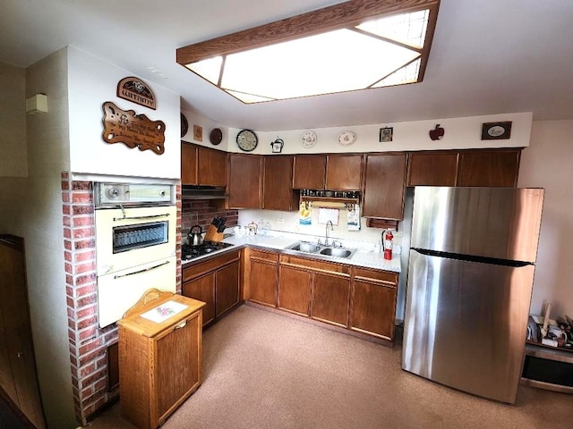 17227 70th Ave, Tinley Park, IL 60477 - kitchen featuring freestanding refrigerator, a skylight, light countertops, white double oven, and under cabinet range hood