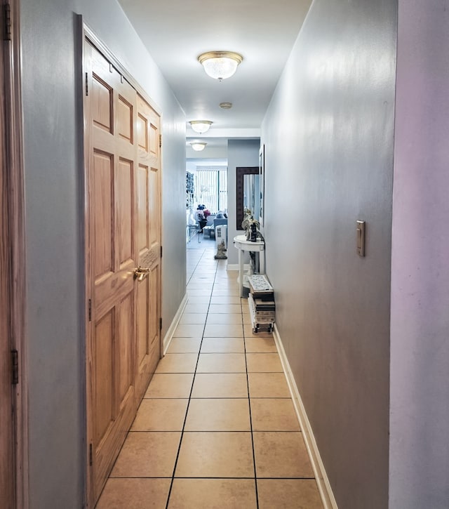 5801 N Sheridan Rd Unit 8A, Chicago, IL 60660 - hallway featuring light tile patterned flooring and baseboards