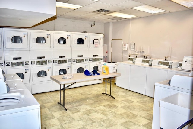 33 W Delaware Pl Unit 13A, Chicago, IL 60610 - shared laundry featuring separate washer and dryer and stacked washer / drying machine