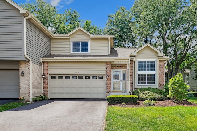 2330 Worthing Dr, Naperville, IL 60565 - view of front of property with asphalt driveway, brick siding, an attached garage, a shingled roof, and a front lawn