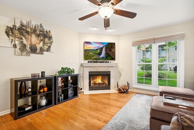 2330 Worthing Dr, Naperville, IL 60565 - living area with wood finished floors, ceiling fan, and a fireplace with flush hearth