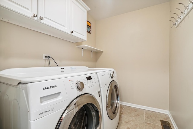 2330 Worthing Dr, Naperville, IL 60565 - laundry room with cabinet space, separate washer and dryer, and light tile patterned flooring